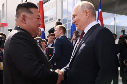 In this pool photo distributed by Sputnik agency, Russia's President Vladimir Putin (R) shakes hands with North Korea's leader Kim Jong Un (L) during their meeting at the Vostochny Cosmodrome in Amur region on September 13, 2023. Russian President Vladimir Putin and North Korean leader Kim Jong Un both arrived at the Vostochny Cosmodrome in Russia's Far East, Russian news agencies reported on September 13, ahead of planned talks that could lead to a weapons deal. (Photo by Mikhail METZEL / POOL / AFP)